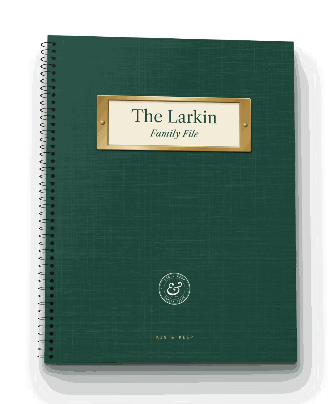 The Family File, an evergreen coil-bound book with a brass label holder